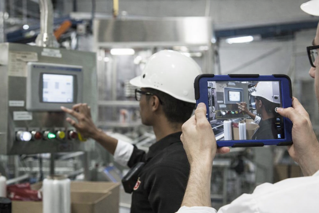 Factory worker filming on ipad